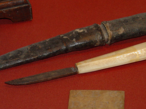 Pen knife and moulded leather case. Mid-17th century.