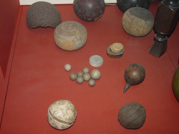 Front left: Leather tennis ball, stuffed with dog hair.